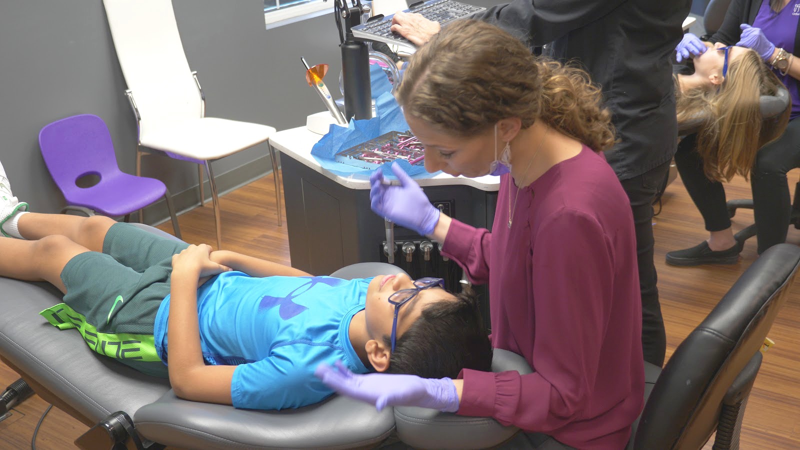 Dr. Rhoads with a young patient